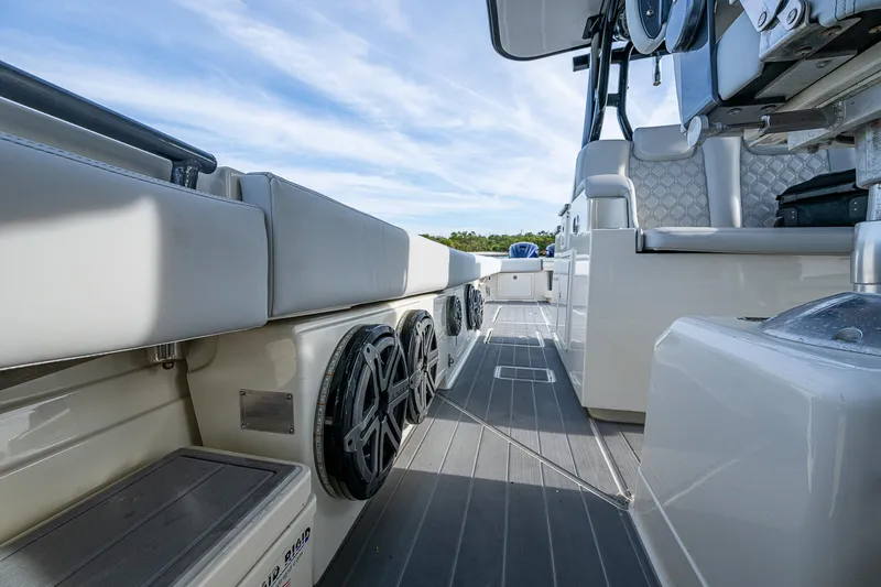 Slide: The Image of 2017 HCB 53 boat interior with cushioned seating and sleek design. - 17