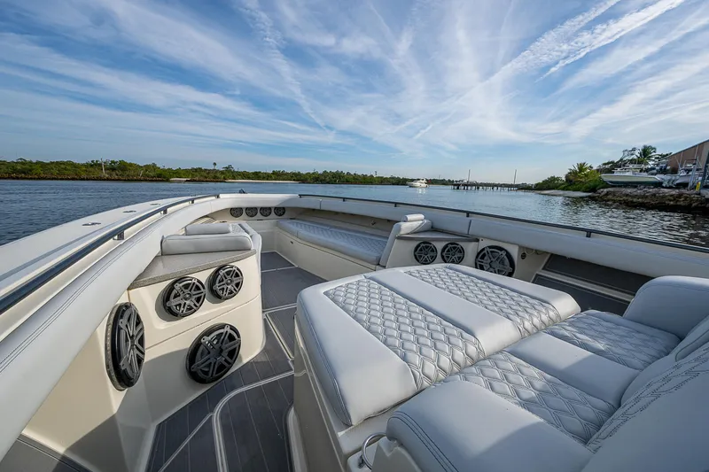 Slide: The Image of Luxurious 2017 HCB 53 boat interior with plush seating and scenic water view. - 29