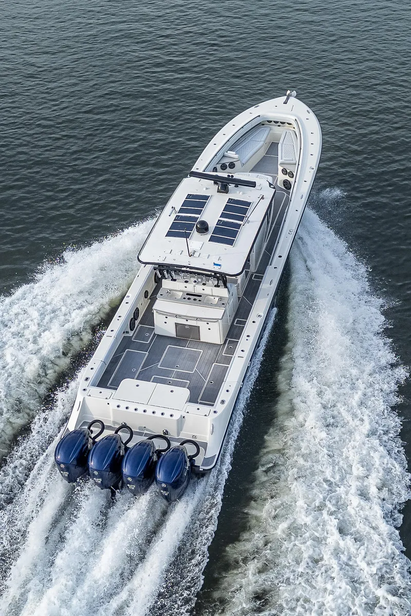 Slide: The Image of HCB 53 boat from 2017 cruising on water with powerful engines. - 36