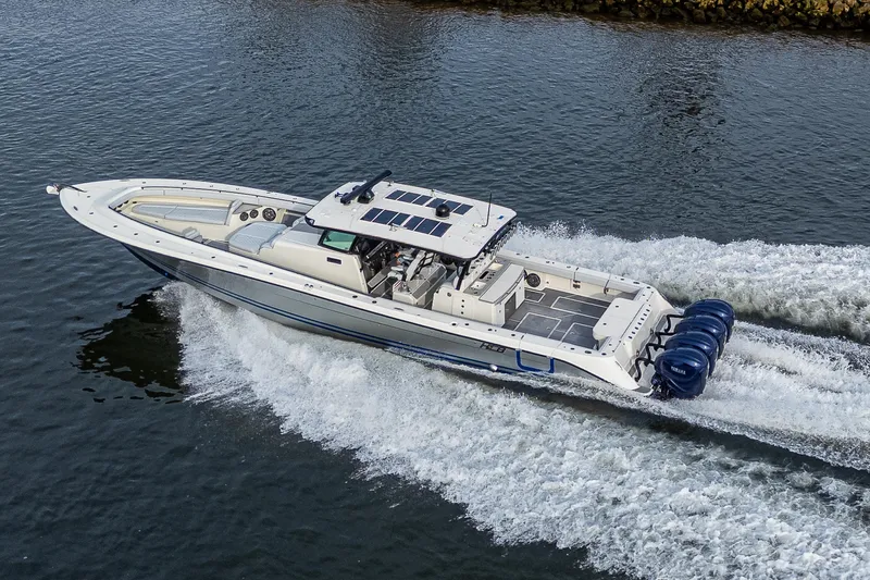 Slide: The Image of 2017 HCB 53 boat cruising on water with powerful engines. - 38