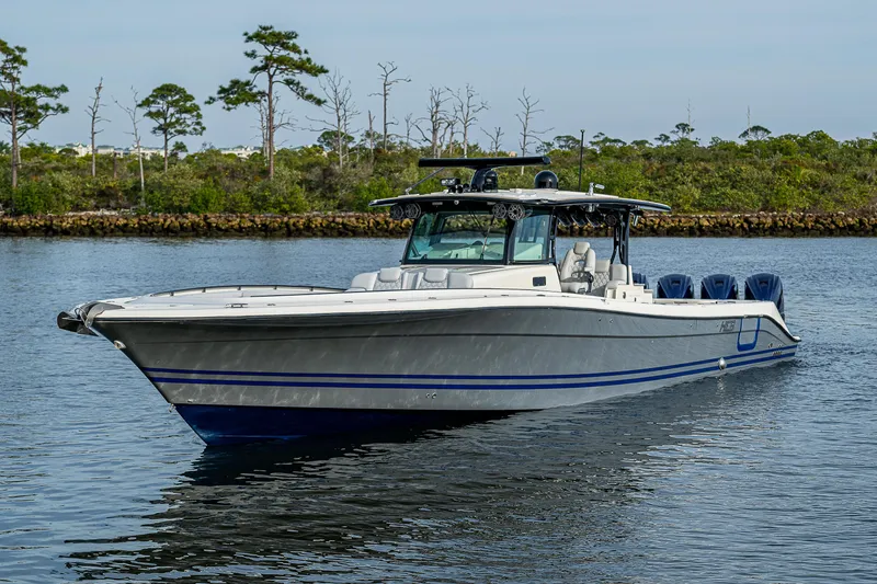 Slide: The Image of 2017 HCB 53 boat on calm water with scenic background. - 4