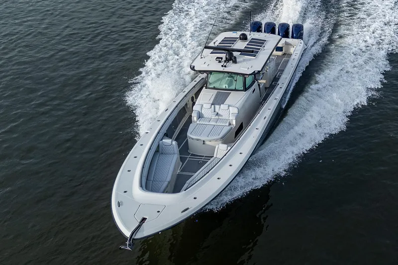 Slide: The Image of 2017 HCB 53 boat cruising on water with powerful engines. - 40
