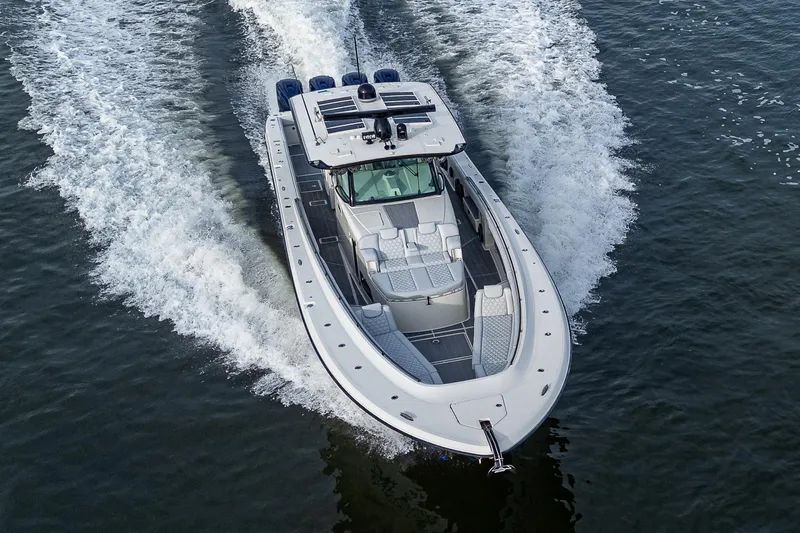 Slide: The Image of 2017 HCB 53 boat cruising on water, aerial view. - 41