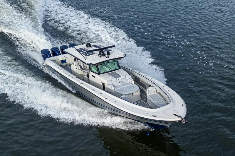 Slide: The Image of HCB 53 boat cruising on water, 2017 model, with multiple outboard engines. - 42