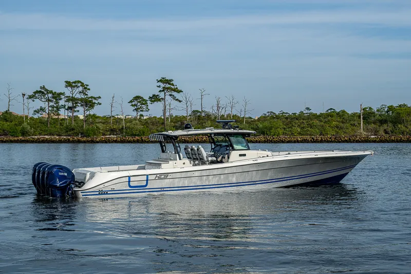 Slide: The Image of 2017 HCB 53 boat on calm water with scenic background. - 7