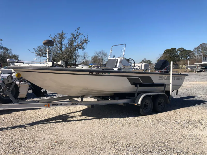 Slide: The Image of 1996 Skeeter ZX200 boat on trailer outdoors. - 11