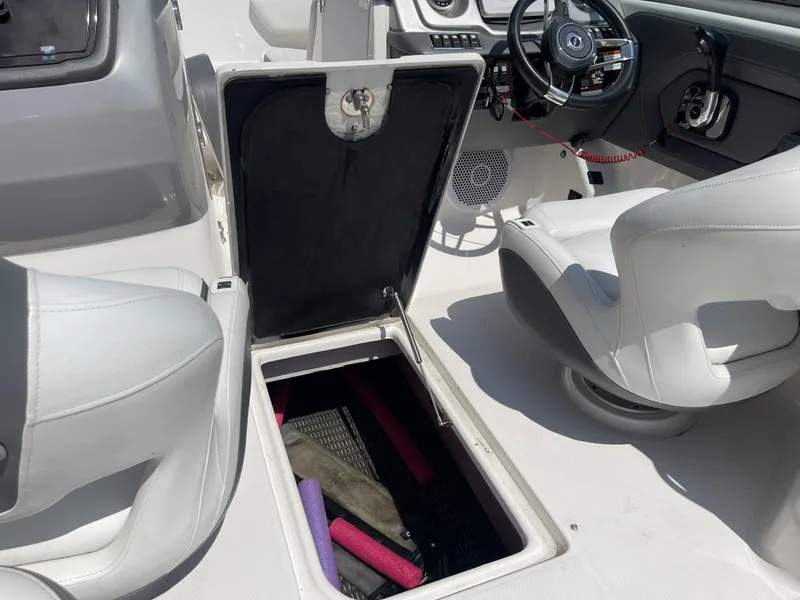 Slide: The Image of 2014 Chaparral Sunesta 224 engine compartment with Interstate batteries and wiring. - 16