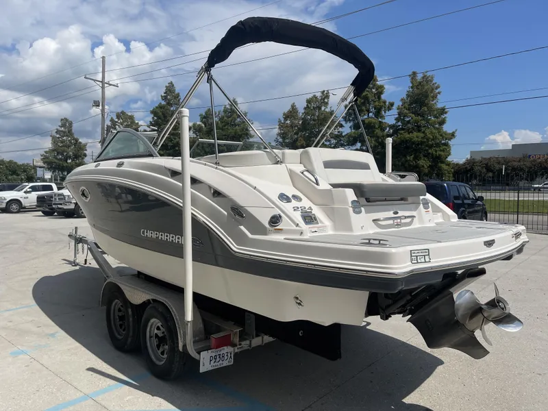 Slide: The Image of 2014 Chaparral Sunesta 224 boat on trailer in sunny parking lot. - 2
