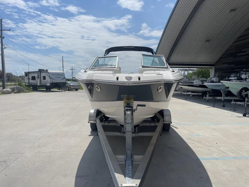 Slide: The Image of 2014 Chaparral Sunesta 224 Deluxe boat dashboard with controls and branding. - 21