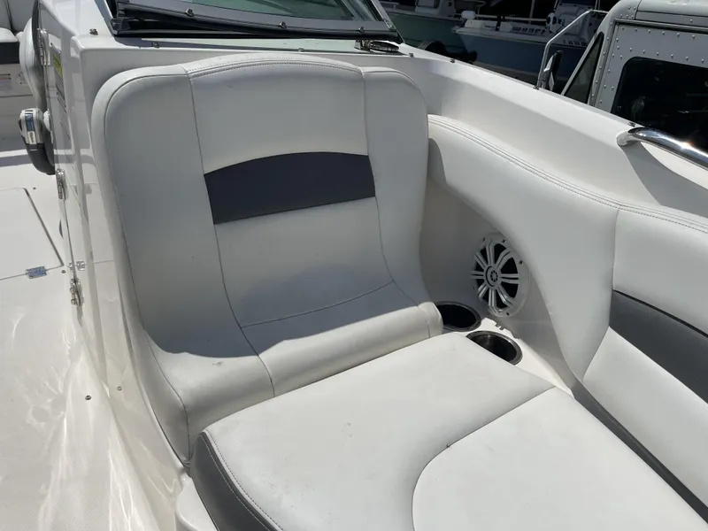 Slide: The Image of 2014 Chaparral Sunesta 224 boat steering wheel and throttle control detail. - 26