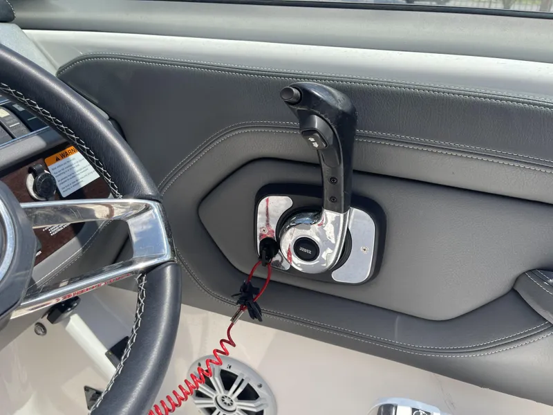 Slide: The Image of 2014 Chaparral Sunesta 224 boat interior with sink and seating area. - 27