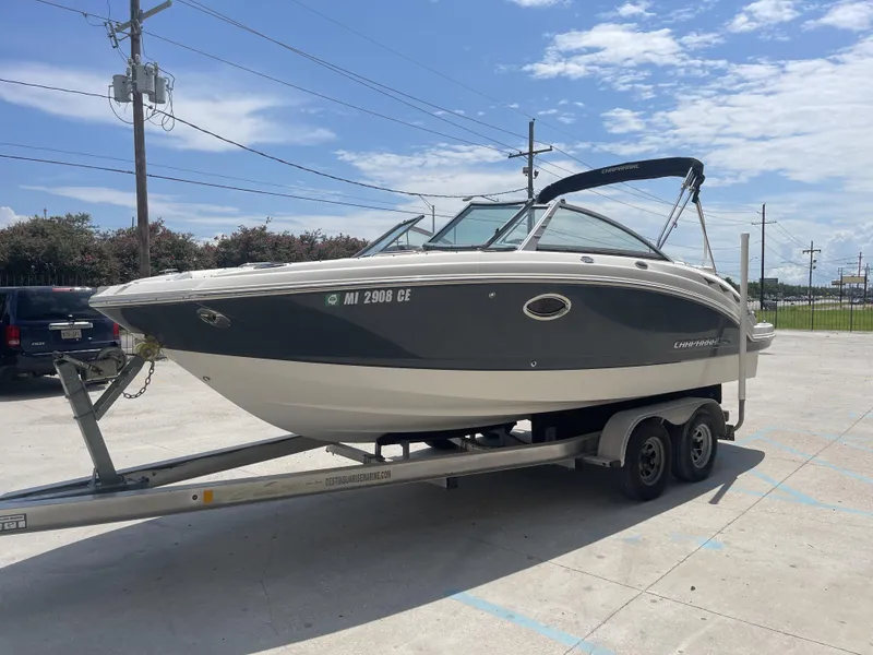 Slide: The Image of 2014 Chaparral Sunesta 224 boat on trailer in parking lot. - 3