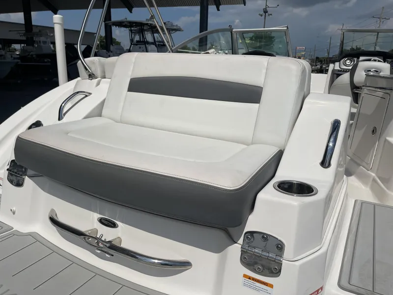 Slide: The Image of 2014 Chaparral Sunesta 224 boat on trailer, parked outdoors under a clear sky. - 4