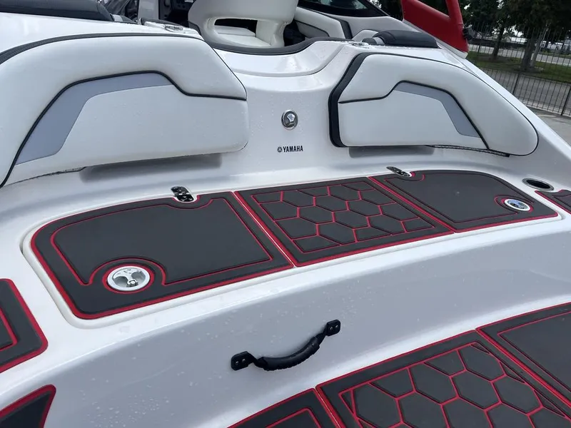 Slide: The Image of 2018 Yamaha Boats AR195 interior with steering wheel and seating. - 10
