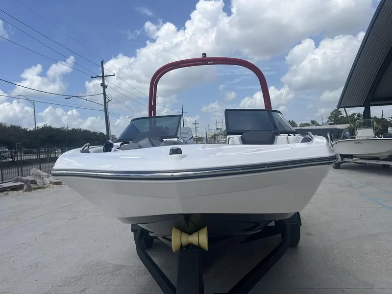 Slide: The Image of 2018 Yamaha Boats AR195 on trailer, parked outdoors under a cloudy sky. - 2