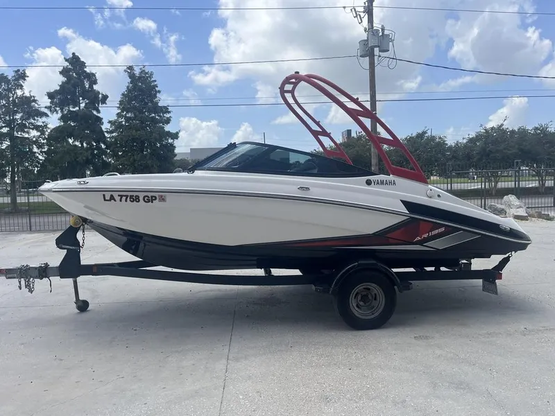 Slide: The Image of 2018 Yamaha AR195 boat on trailer, featuring sleek design and red accents. - 7