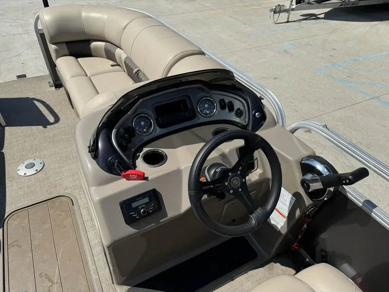 Slide: The Image of 2023 Sun Tracker Party Barge 22 DLX interior with steering console and seating. - 14