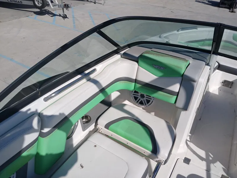 Slide: The Image of 2016 Chaparral 203 Vortex boat interior with green and white seating. - 11