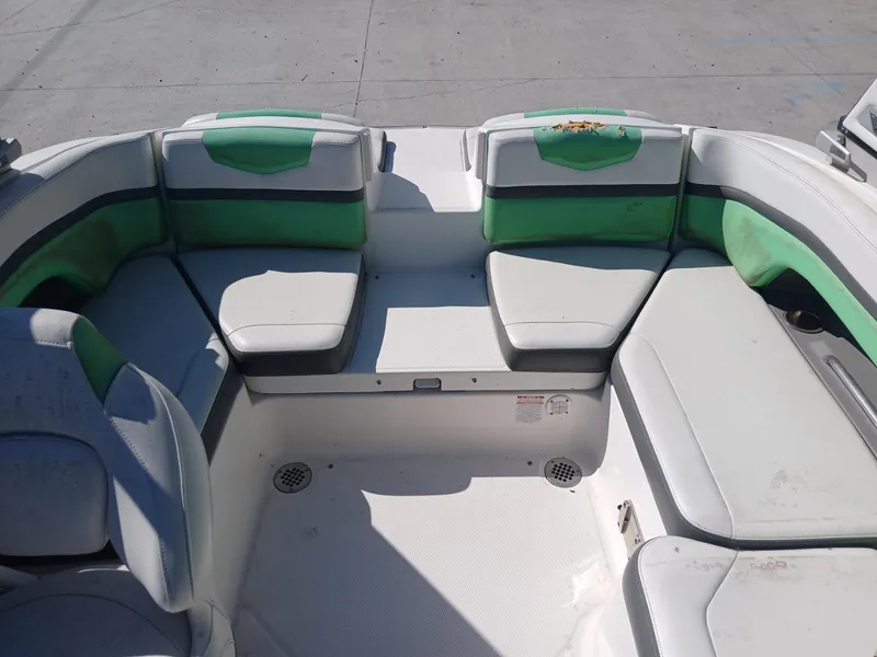 Slide: The Image of 2016 Chaparral 203 Vortex boat interior with green and white seating. - 12
