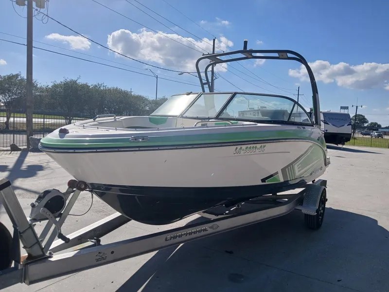 Slide: The Image of 2016 Chaparral 203 Vortex boat on trailer, sunny day, outdoor setting. - 6