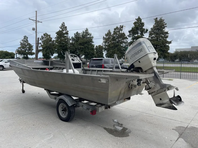 Slide: The Image of Custom 1991 18ft aluminum boat with Evinrude outboard motor on trailer. - 10