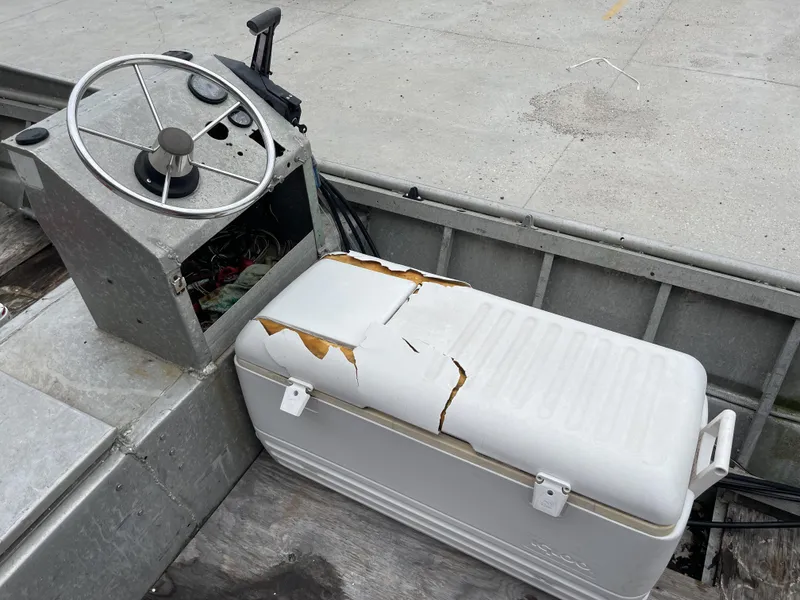 Slide: The Image of Old boat console with steering wheel and damaged cooler, Custom 18ft, 1991 model. - 6