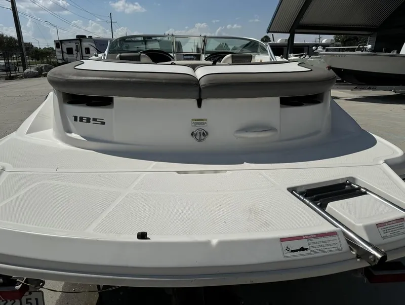 Slide: The Image of 2011 Sea Ray 185 Sport boat, rear view with swim platform and ladder. - 9