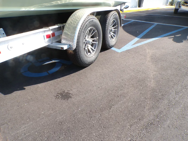 Slide: The Image of Trailer of 2024 Parker 2600 Center Console parked in a handicapped space. - 10