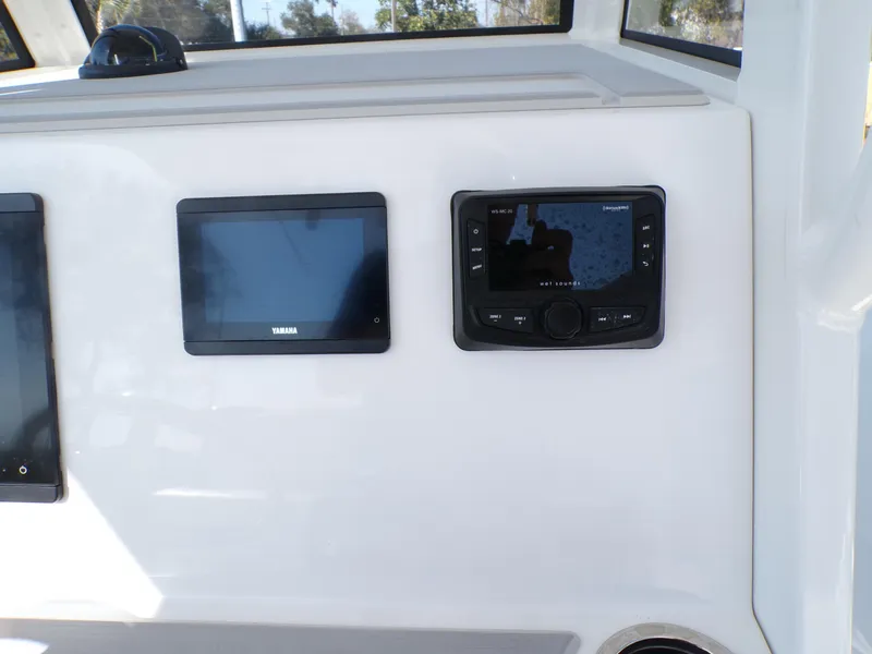 Slide: The Image of 2024 Parker 2600 Center Console dashboard with Yamaha and Fusion displays. - 13