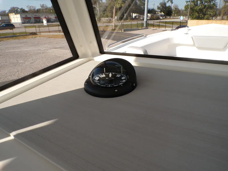 Slide: The Image of 2024 Parker 2600 Center Console boat with compass on dashboard. - 15