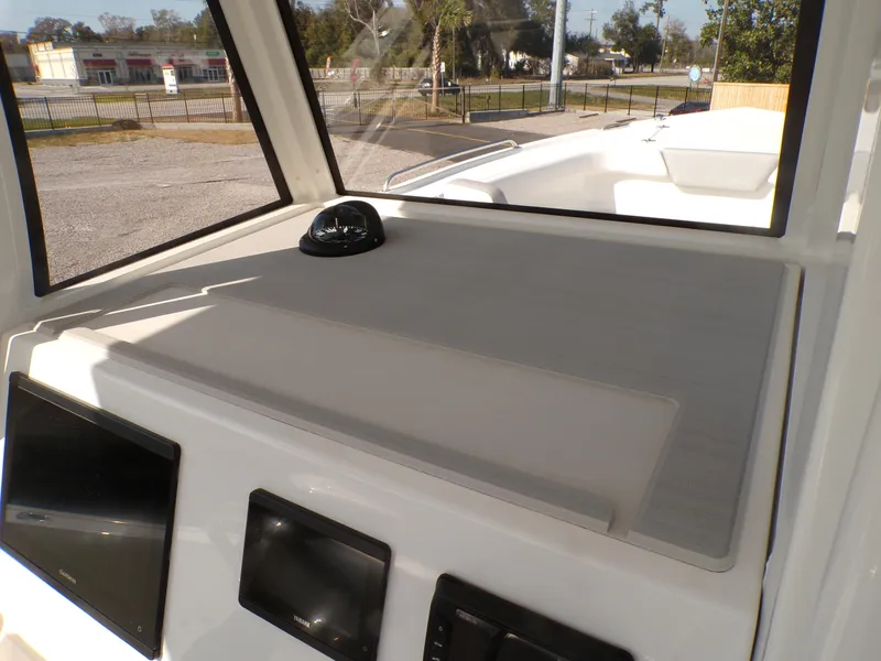 Slide: The Image of 2024 Parker 2600 Center Console boat dashboard with navigation instruments. - 16