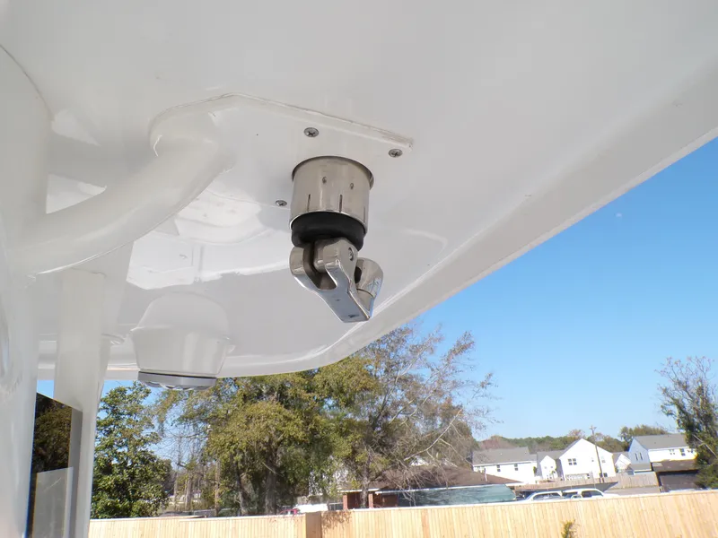 Slide: The Image of 2024 Parker 2600 Center Console boat detail, featuring a mounted rod holder under a clear blue sky. - 18