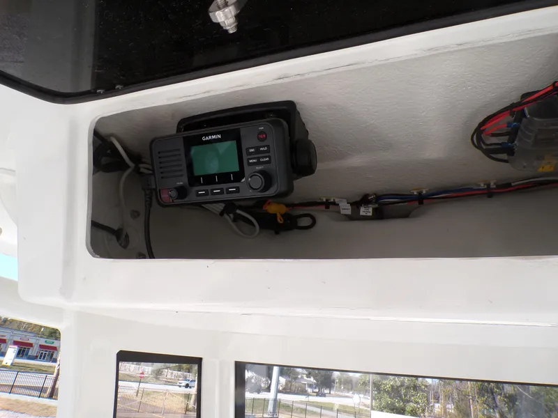 Slide: The Image of 2024 Parker 2600 Center Console boat interior with Garmin radio equipment. - 19