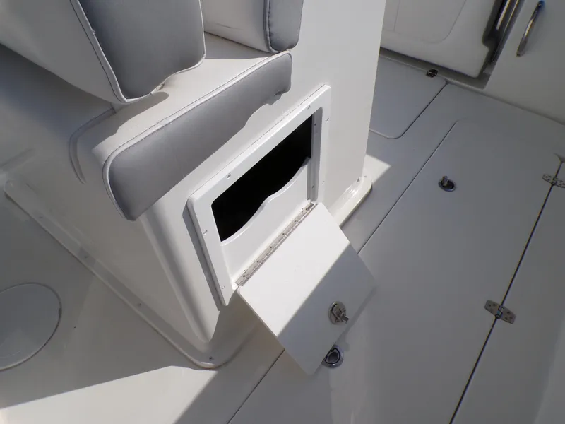Slide: The Image of 2024 Parker 2600 Center Console boat storage compartment with open hatch. - 23