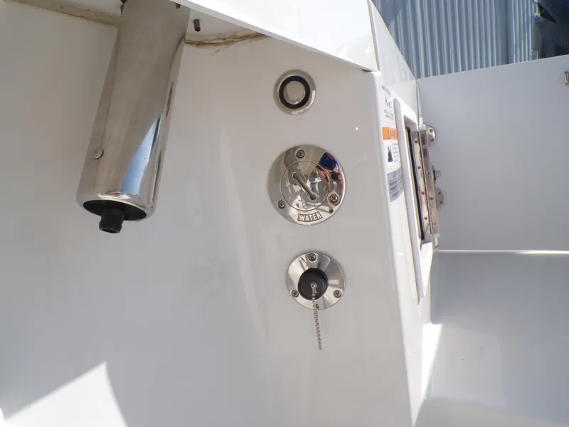Slide: The Image of 2024 Parker 2600 Center Console boat detail showing fuel and water inlets. - 24