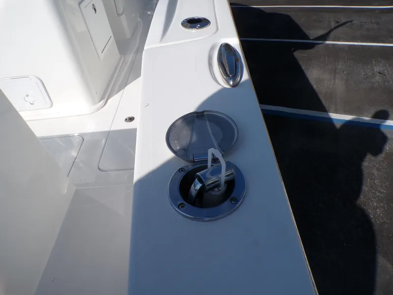 Slide: The Image of 2024 Parker 2600 Center Console boat deck with open hatch and fittings. - 28