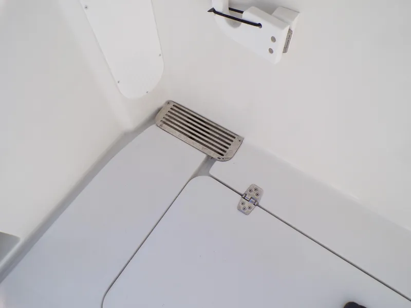 Slide: The Image of 2024 Parker 2600 Center Console boat interior detail with vent and hinge. - 32