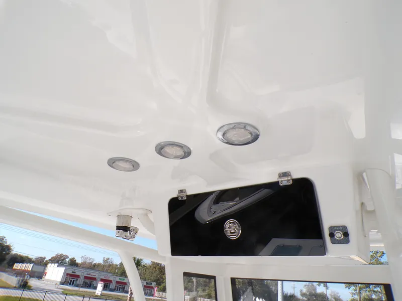 Slide: The Image of 2024 Parker 2600 Center Console boat interior ceiling with lights and storage compartment. - 39