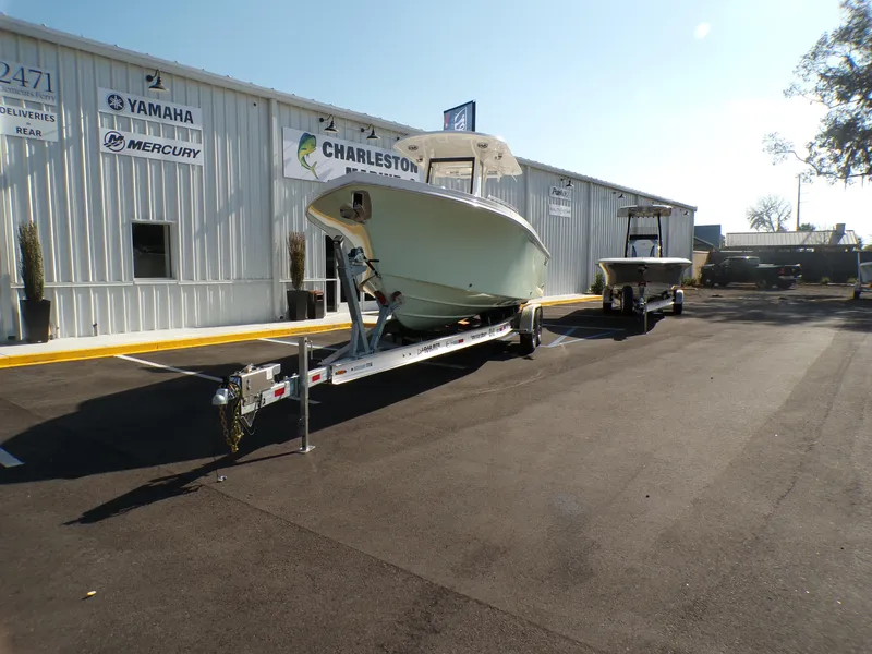 Slide: The Image of 2024 Parker 2600 Center Console boat on trailer outside dealership. - 4