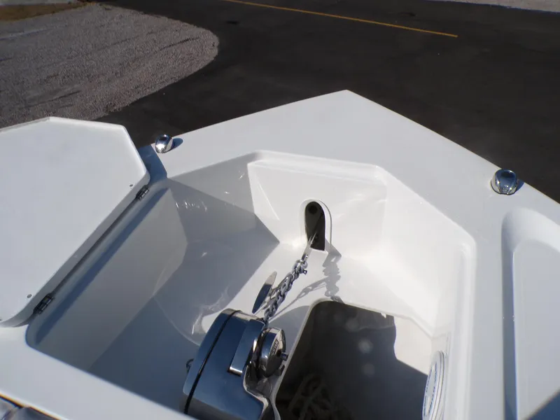 Slide: The Image of 2024 Parker 2600 Center Console boat anchor compartment with chain and winch. - 42
