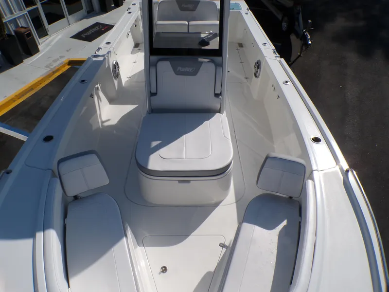 Slide: The Image of 2024 Parker 2600 Center Console boat interior with white seating and console. - 48