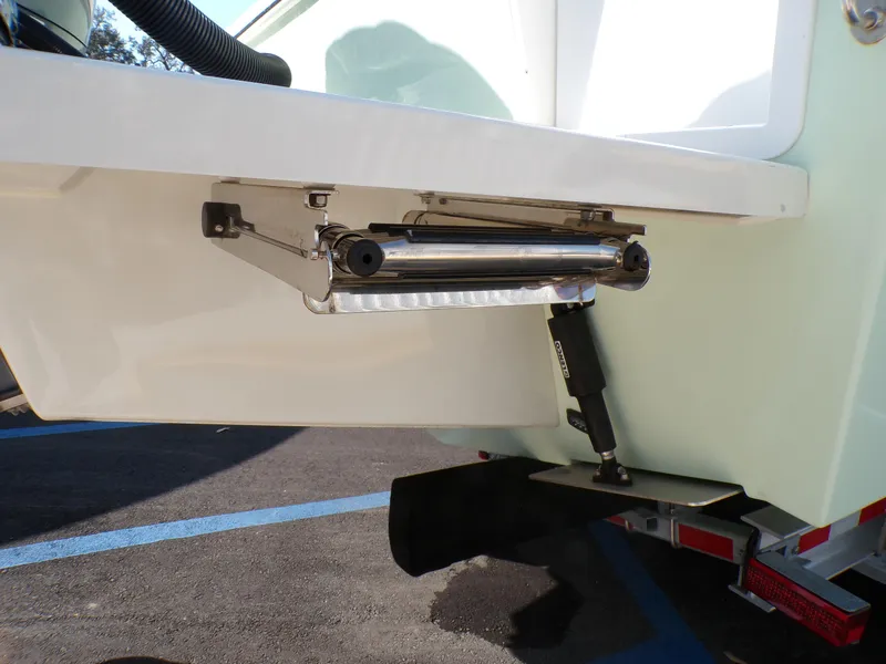 Slide: The Image of 2024 Parker 2600 Center Console boat trim tab detail on trailer. - 6