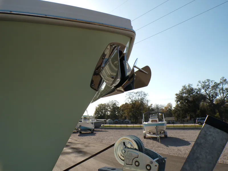 Slide: The Image of 2024 Parker 2600 Center Console boat with anchor, parked on a trailer. - 9