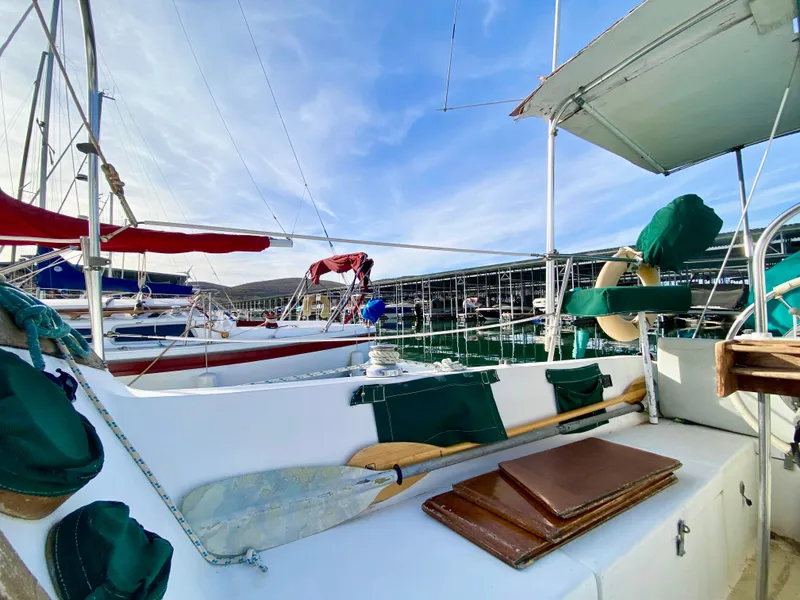 Slide: The Image of 1978 Catalina 30 sailboat docked, featuring deck details and marina background. - 30