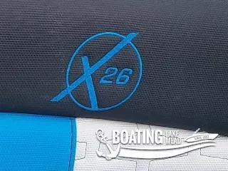 Slide: The Image of 2021 MasterCraft X26 logo on a textured surface, Boating Lake Mead branding. - 24
