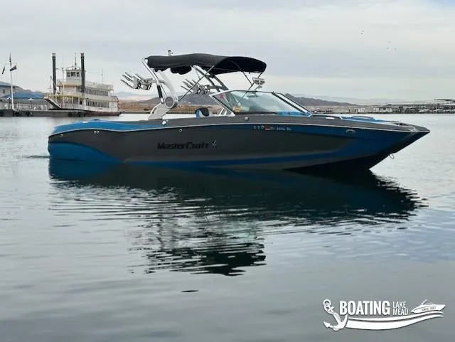 Slide: The Image of 2021 MasterCraft X26 boat on calm water at Lake Mead. - 9