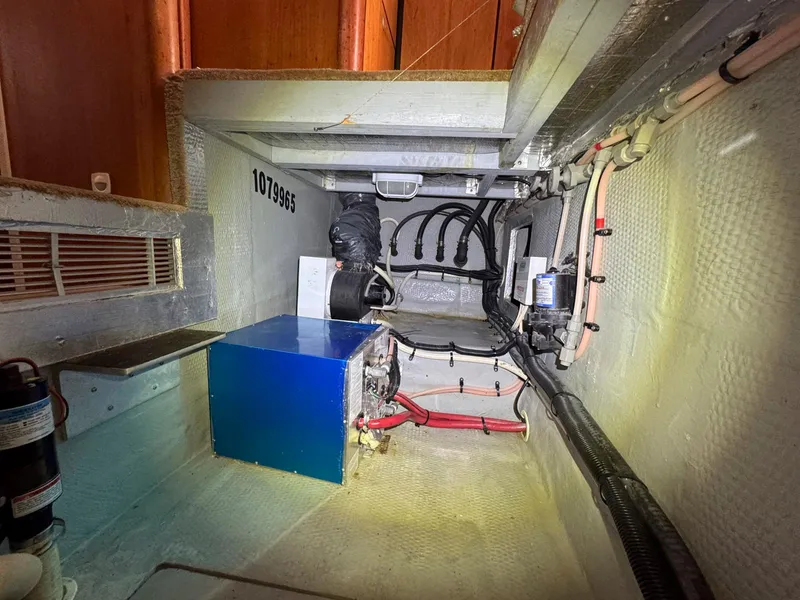 Slide: The Image of Engine room of 1999 Luhrs 360 Convertible boat, showing equipment and wiring. - 19