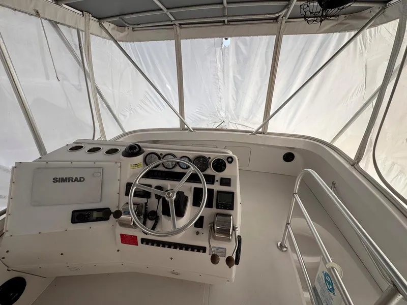 Slide: The Image of 1999 Luhrs 360 Convertible boat helm with Simrad navigation system. - 4