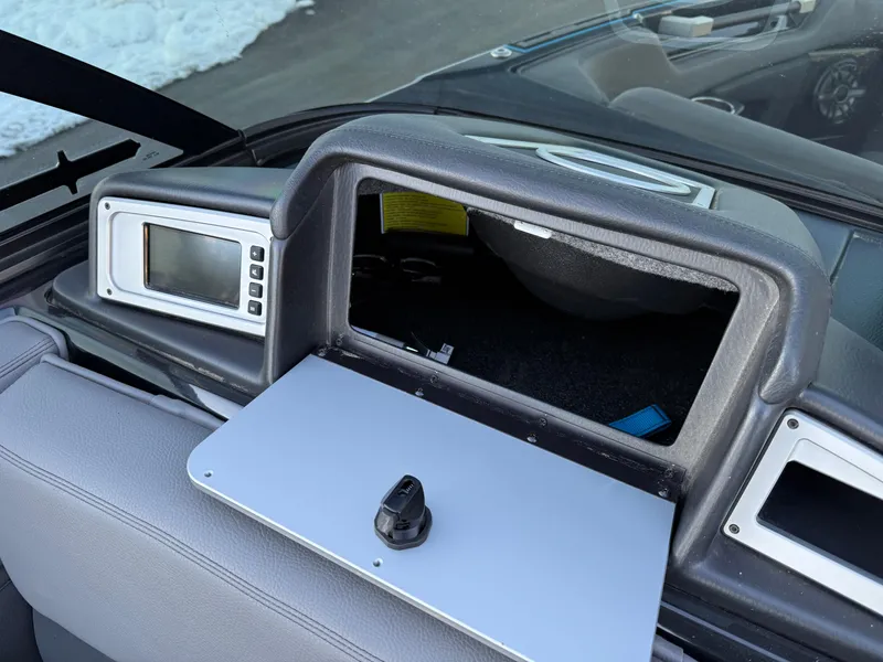 Slide: The Image of 2022 Supra SL dashboard with open glove compartment and control panel. - 13