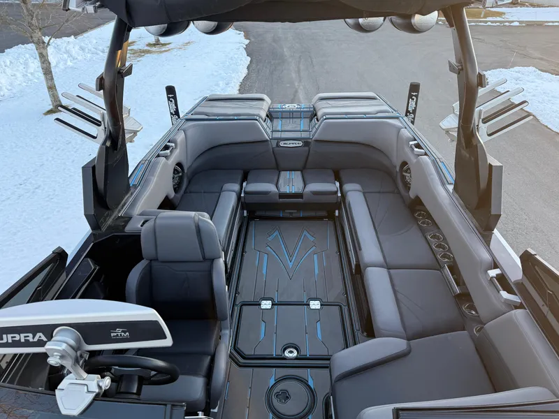 Slide: The Image of 2022 Supra SL boat interior with sleek seating and modern design. - 15